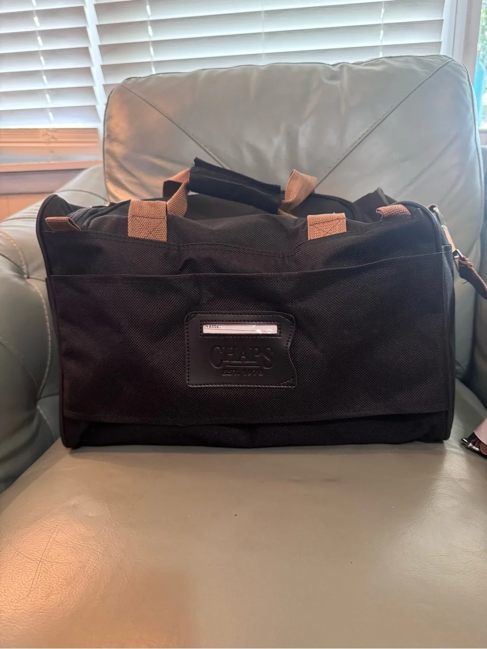 Chaps Black Duffel Bag with Tan Trim shoulder strap and double handle